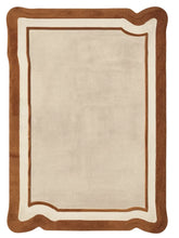 A rectangular area rug with a scalloped border, featuring a warm cream center, a white inner border, and a wide brown outer border.