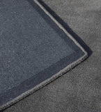 Handcrafted grey rug with embossed rectangle minimalist style