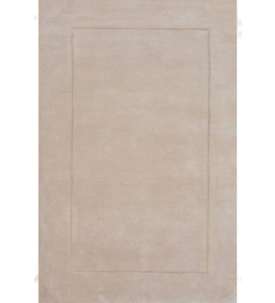 Solid beige hand-tufted wool rug with subtle border design