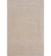Solid beige hand-tufted wool rug with subtle border design