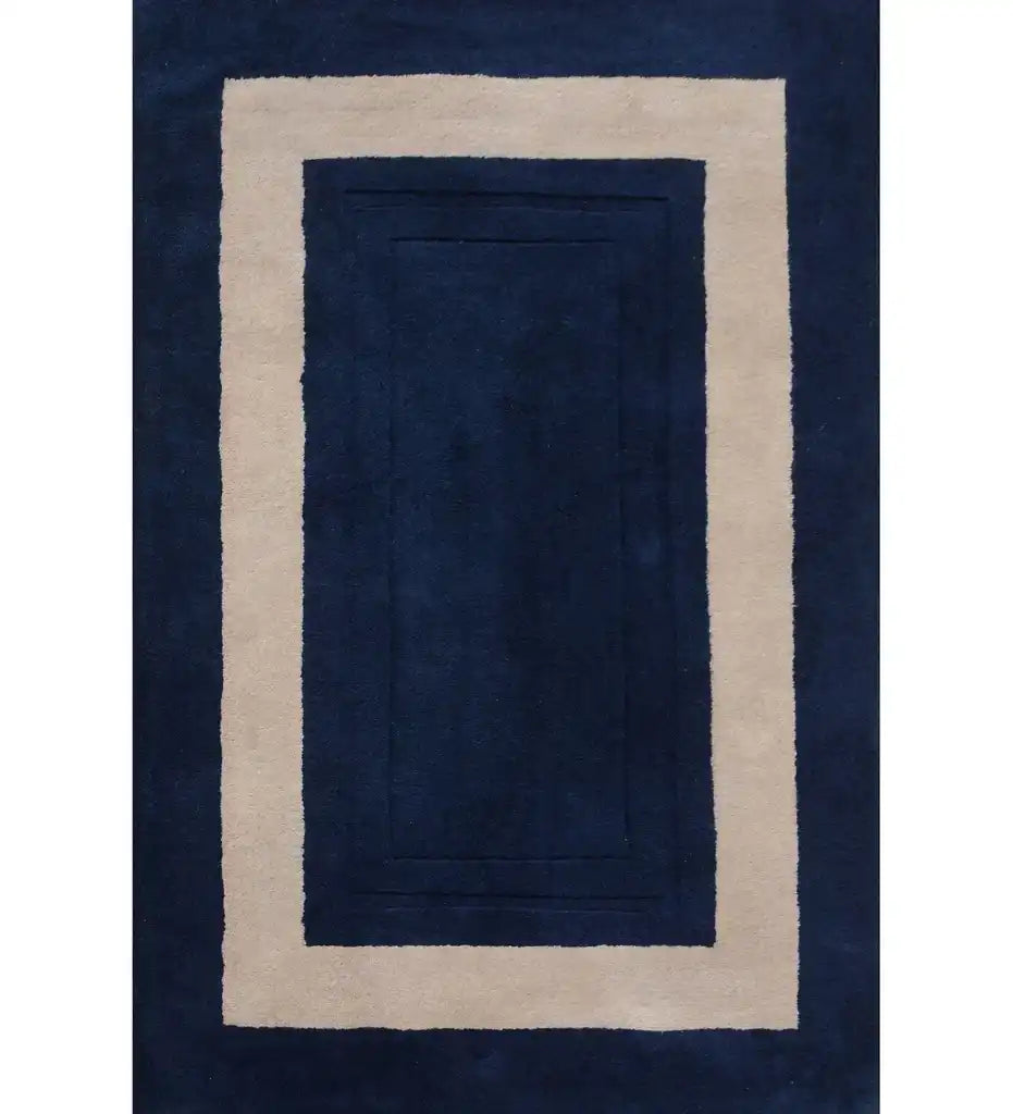 Solid midnight blue rug with a minimalist beige rectangular border design