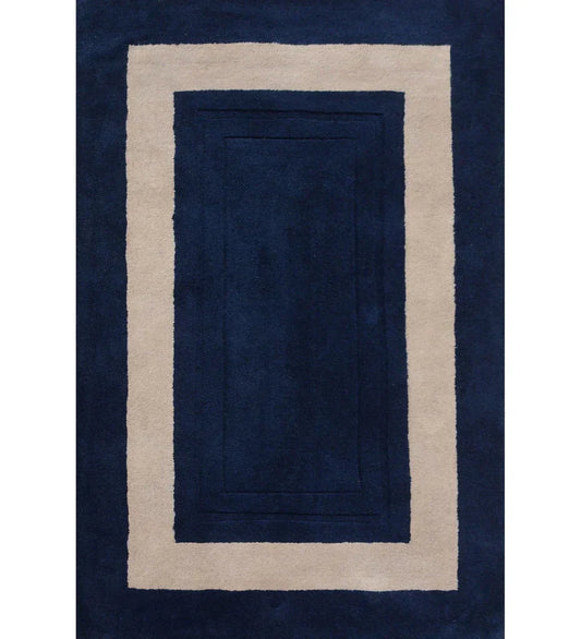 Navy blue hand tufted rug with beige border