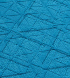 Solid blue modern geometric rug with embossed overlapping triangle pattern