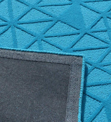 Blue geometric triangle pattern rug with textured surface and fabric backing