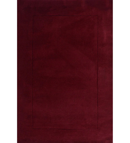 Solid maroon hand-tufted wool rug with minimalist rectangle design