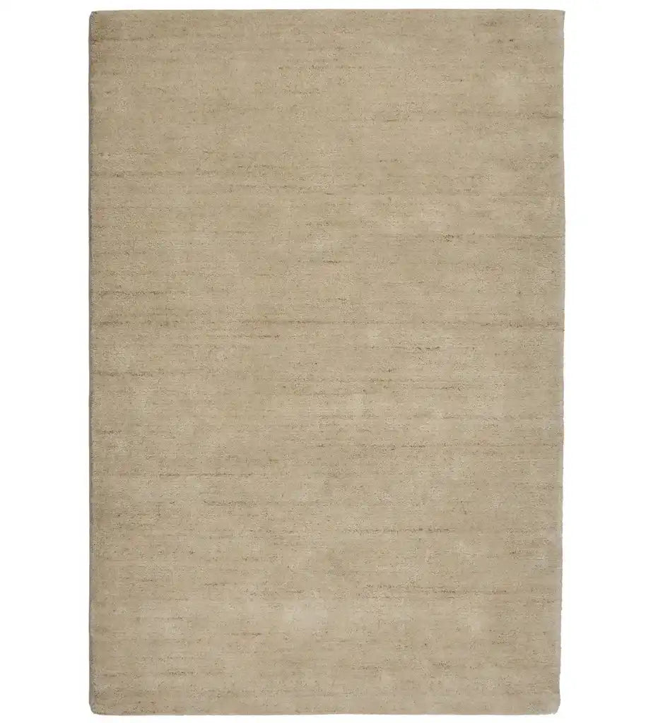 Solid taupe neutral minimalist rug with soft texture and subtle color variations