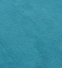 Luxury teal wool rug with contemporary textured finish