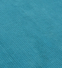 Luxury teal wool rug with contemporary textured finish