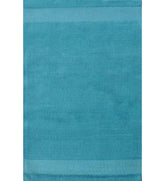 Solid teal hand-tufted wool rug with minimalist linear design