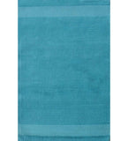 Solid teal hand-tufted wool rug with minimalist linear design