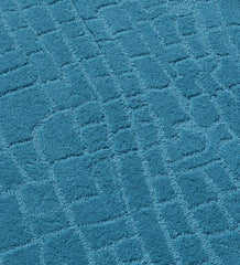 Luxury minimalist teal hand-tufted rug with texture