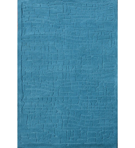 Teal textured hand-tufted wool rug with subtle geometric design