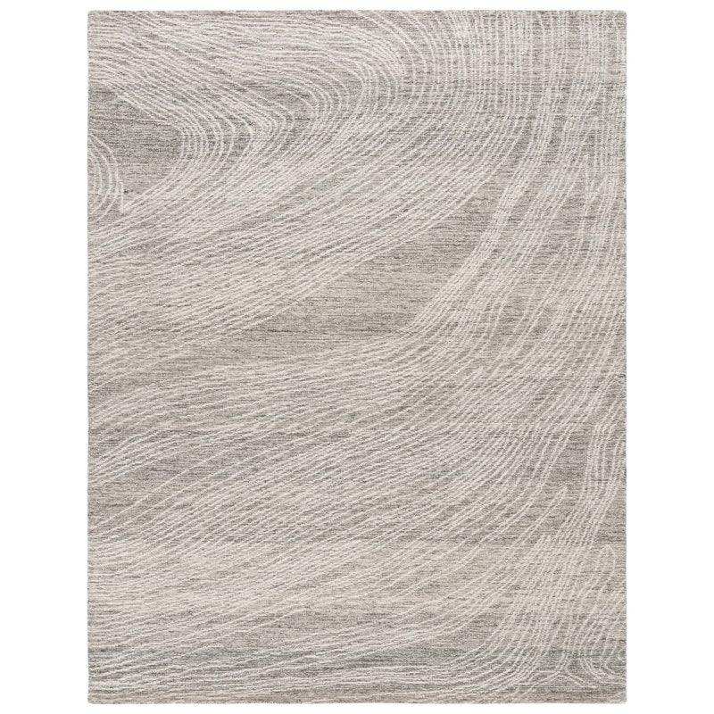 Stone Drift hand-tufted wool rug in neutral beige with flowing wave pattern, luxury home decor
