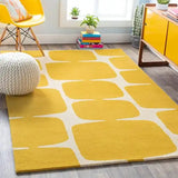 Bright yellow and white hand-tufted rug in modern living room with yellow chair, wooden cabinet, and plants