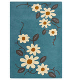 Teal floral hand-tufted wool rug with white daisy pattern