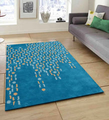 Modern artisan wool rug featuring teal base with abstract dots