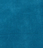Modern solid teal rug featuring bordered design detail