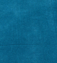 Modern solid teal rug featuring bordered design detail