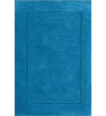 Solid teal hand-tufted wool rug with minimalist border design
