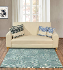 Modern geometric rug with overlapping circular pattern in teal