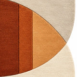 Close-up of blue, rust and cream geometric wool rug pattern for a bedroom, 6x9 size