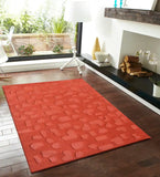 Modern orange rug featuring embossed textured block pattern