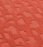 Luxury terracotta wool rug with raised abstract details