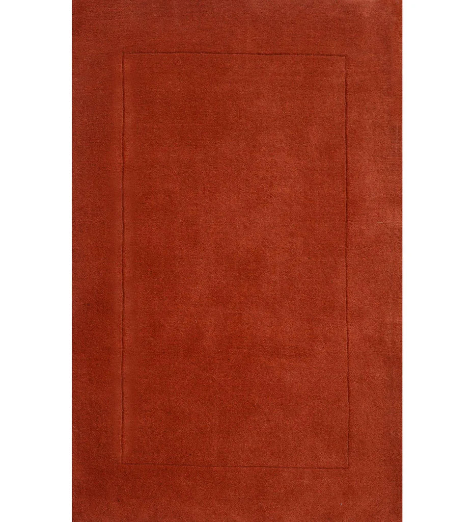 Solid terracotta orange hand-tufted wool rug with embossed rectangle