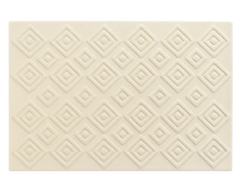 Sculpted geometric diamond rug in premium cream wool texture.