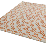 Luxury handwoven rug with beige background and geometric orange interconnected pattern