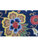 Close-up of luxury handwoven rug with vibrant floral pattern in blue, yellow, red, and green colors