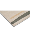 Corner of luxury handwoven rug with beige base and two textured stripes in mustard and gray