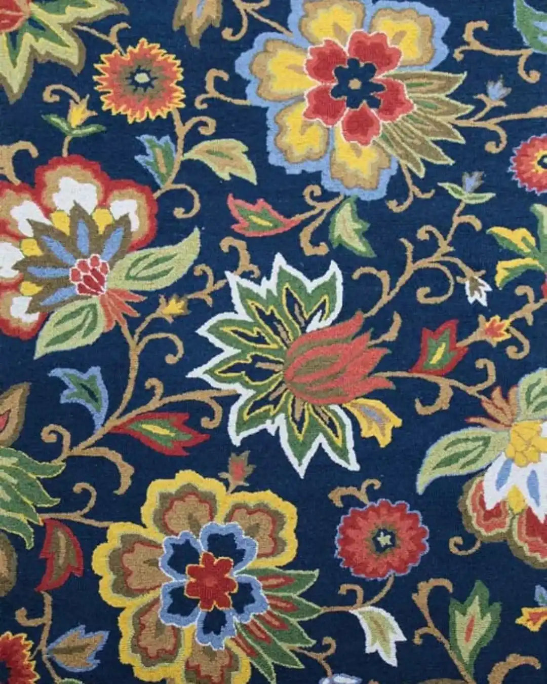 Luxury handwoven rug with colorful floral patterns on deep blue background from Mannat Rugs