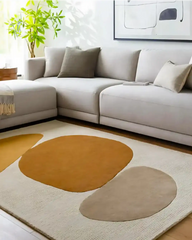 Modern living room with beige sectional sofa and abstract luxury rug in brown and tan shapes