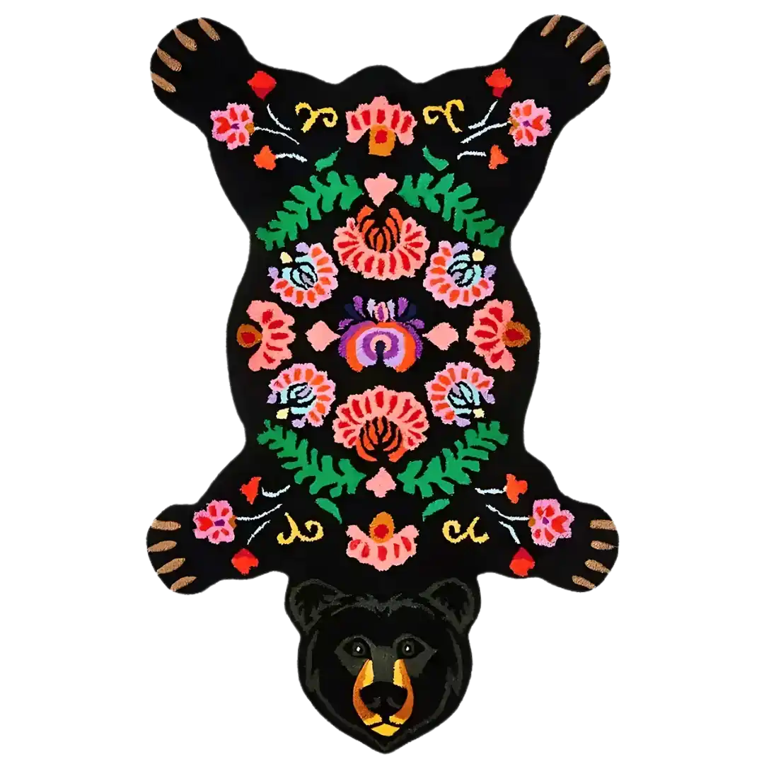 Black bear rug illustration with colorful floral, botanical embroidery on black background