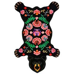 Black bear rug illustration with colorful floral, botanical embroidery on black background