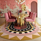 Luxury dining room with pink velvet chairs, gold reflective table, geometric rug, swan wall mural, and modern chandelier
