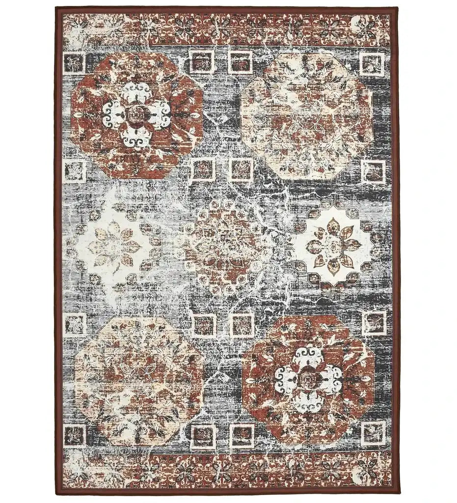 Vintage-style geometric patterned rug with octagonal medallions in rust, beige, and gray tones