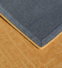 Minimalist mustard yellow wool rug with subtle texture