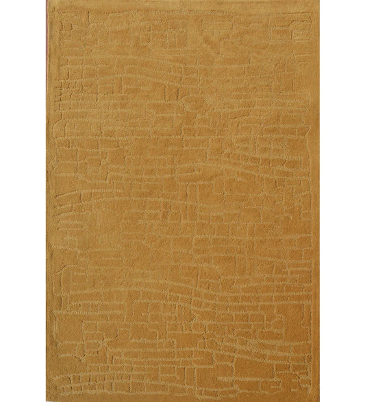 Golden mustard hand-tufted wool rug with subtle embossed pattern