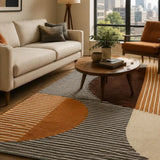 Modern living room with a large rug, sofa, coffee table, and city view.