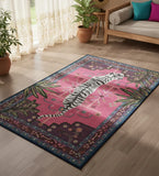 Decorative rug with a tiger design on a wooden floor in a living room.