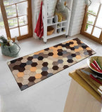 Hexagon pattern runner rug in a bright kitchen with white brick walls and wooden accents