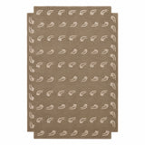 A rectangular area rug in a warm taupe-brown color, featuring a repeating pattern of small white stylized leaf or feather motifs and a matching white border.
