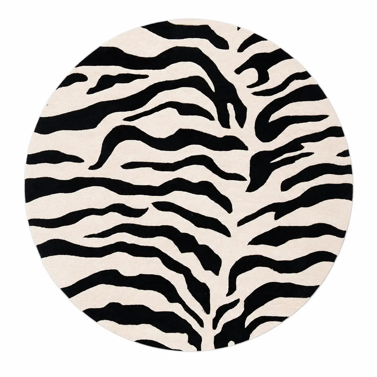 A round rug featuring a bold black and off-white zebra stripe pattern, shown against a plain white background.
