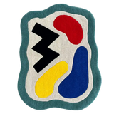 Abstract color block wavy border rug with red, blue, yellow, black, and teal shapes on a white background