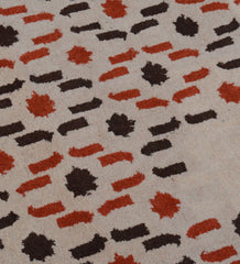 Luxury hand-tufted rug with cascading beige and orange pattern