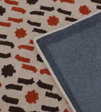 Beige wool rug with contemporary orange and brown dotted cascade