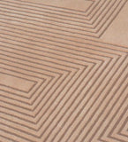 Beige modern geometric patterned rug with raised linear zigzag design texture