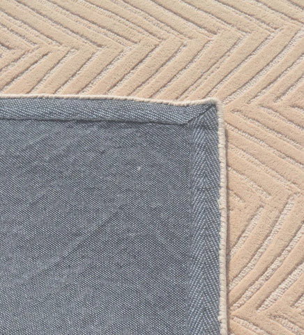 Scandinavian-style textured beige wool rug.